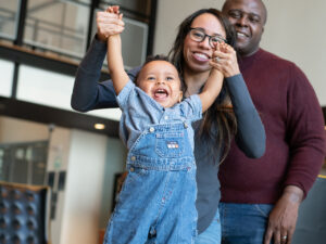 Happy baby with mom and dad